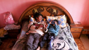 A scene from Salero: Moises Chambi Yucra and his son Maykel at home.