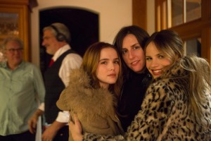 Zoey Deutch (left), director Ry Russo-Young (center), and Halston Sage (right) on the set of Before I Fall